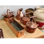 Assorted Victorian copper including two planters, a measure, two kettles, and a house plant watering
