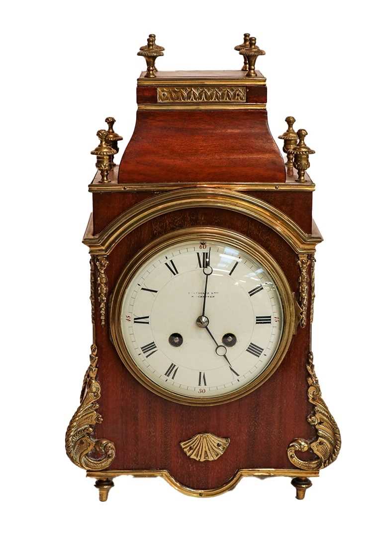 A mahogany and brass mounted striking mantel clock, circa 1900, retailed by Finnigans Ltd,