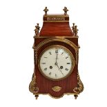 A mahogany and brass mounted striking mantel clock, circa 1900, retailed by Finnigans Ltd,
