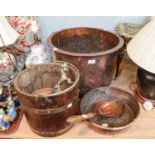 A staved oak peat bucket, copper cauldron, a brass footman, two copper vessels, and a coal scoop (