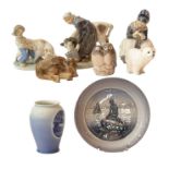 A quantity of Royal Copenhagen figure groups including a milkmaid and cow, a brown bear etc;