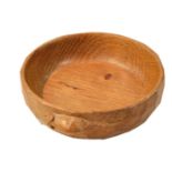 A Robert 'Mouseman' Thompson Yorkshire oak nut dish, with adzed sides and carved to the side with