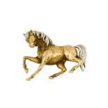 A horse brooch, the horse realistically modelled with a yellow textured body and a white mane and