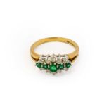 A 9 carat gold emerald and diamond cluster ring, five graduated round cut emeralds flanked by rows