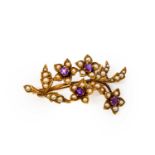 A split pearl and amethyst brooch, realistically modelled as a floral spray, set throughout with