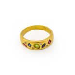 A synthetic ruby, synthetic sapphire, peridot and diamond ring, the yellow plain polished band inset