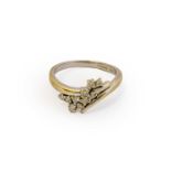 An 18 carat white gold diamond ring, the spray motif set throughout with round brilliant cut