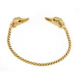 A 9 carat gold torque bangle, by Harriet Glen, the yellow rope twist bangle terminates to