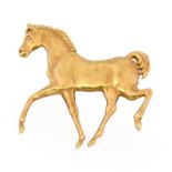 A 9 carat gold horse brooch, the yellow plain polished horse realistically modelled in a trotting