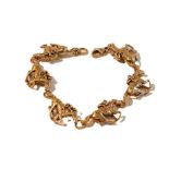 A 9 carat gold horse bracelet, by Harriet Glen, formed of six chain-linked galloping horse and