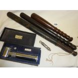 Three police truncheons, one painted Victorian Special Constable (paint flaking), a Metropolitan