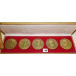 A cased presentation set of five large figural bronze medallions commemorating the Portuguese Navy