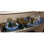 Nine assorted German Hock glasses, having gold vine leaf decoration and green stepped stems, a
