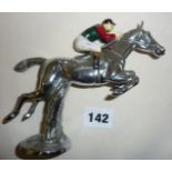 Vintage chrome car mascot in the form of a painted jockey on a jumping racehorse