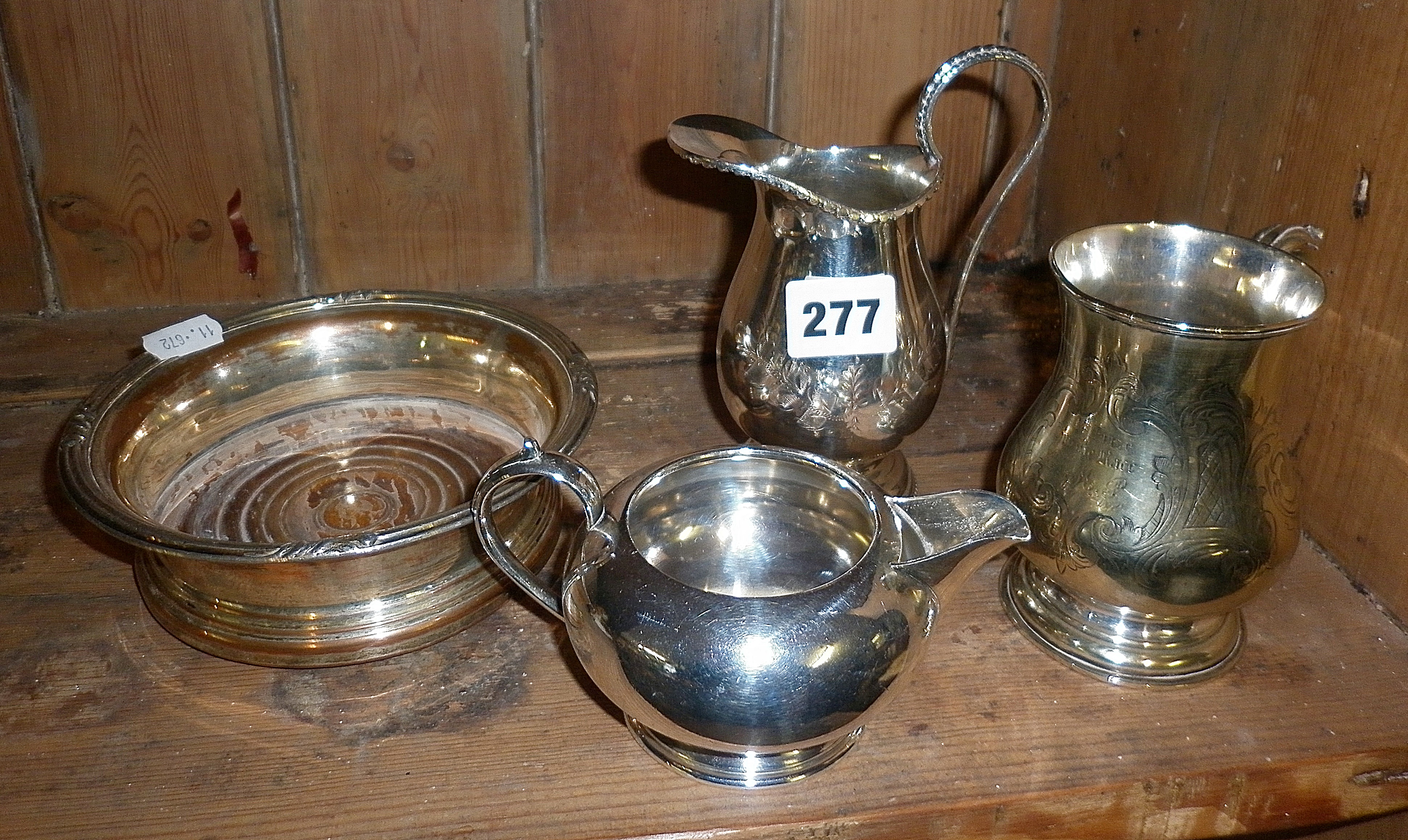 Sheffield plate wine coaster, two silver plated cream jugs and a tankard