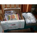 Box of knitting and crochet pattern books and assorted pieces of embroidered cotton