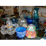Collection of assorted coloured glassware including hall light shades, advertising milk bottles,
