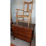 Chest of three drawers and a rush seat elbow chair