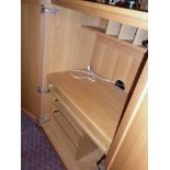 Modern light oak "home office" cupboard with two doors enclosing slide-out computer desk and