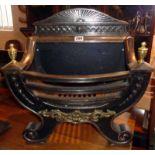 Regency style cast iron fire grate with brass mounts