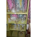 Three shelves of glassware, inc. decanters and jugs etc.