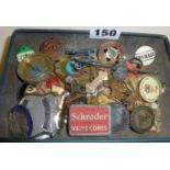 Vintage enamel and other badges in a Rowntree tin