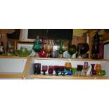 Two shelves of assorted coloured glassware (35 pieces)