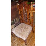 Ornately carved Victorian mahogany nursing chair