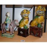 Chinese polychrome glazed pottery figure of a man on a horse and two Chinese porcelain Sancai Fo