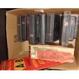 Box containing 11 small bibles, Chambers Dictionary and vintage Road Atlas