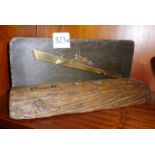 Trench Art rendition of a German U Boat, on slate back with later attached wooden pen stand