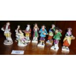 Six small Continental porcelain figurines with gold anchor mark and three others