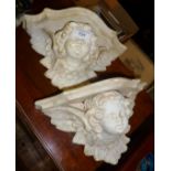 Pair of plaster cherub wall brackets