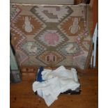 Box of linen and dhurry rug