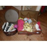 Leather suitcase containing vintage clothing and a hat box of handbags