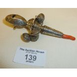 19th c. engraved silver baby's rattle with integral whistle and coral teether. Rubbed 800 mark under