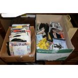 Box of vinyl singles records and a box of CD's