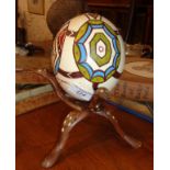 Painted ostrich egg on stand