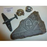 Possible WW2 German POW carved stone, an SS cap badge, etc.