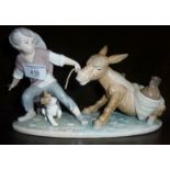 Lladro boy pulling a donkey figurine