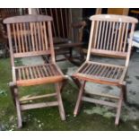 Pair of teak folding garden chairs