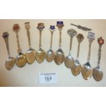 Ten enamel souvenir spoons, some silver