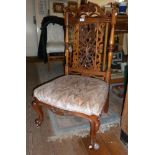 Ornately carved Victorian mahogany nursing chair