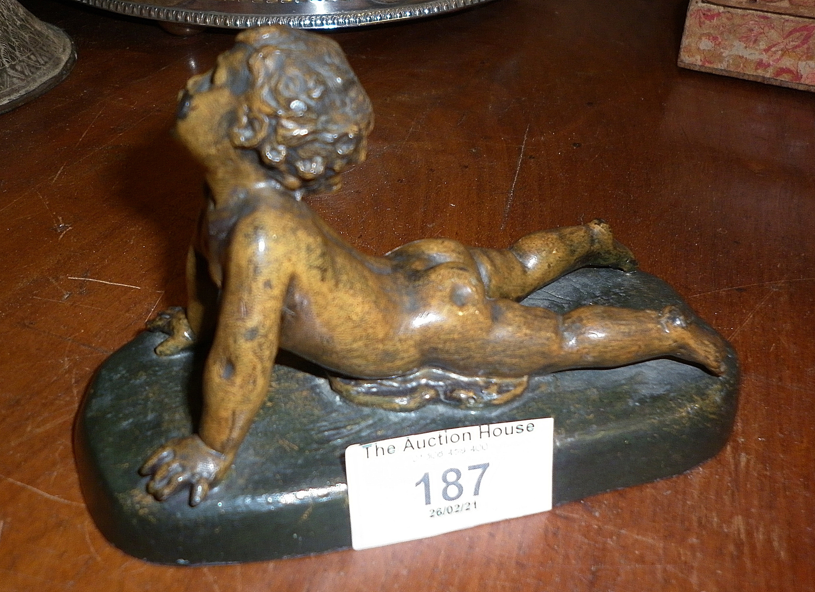 19th c. bronze figure of a child, indistinctly signed