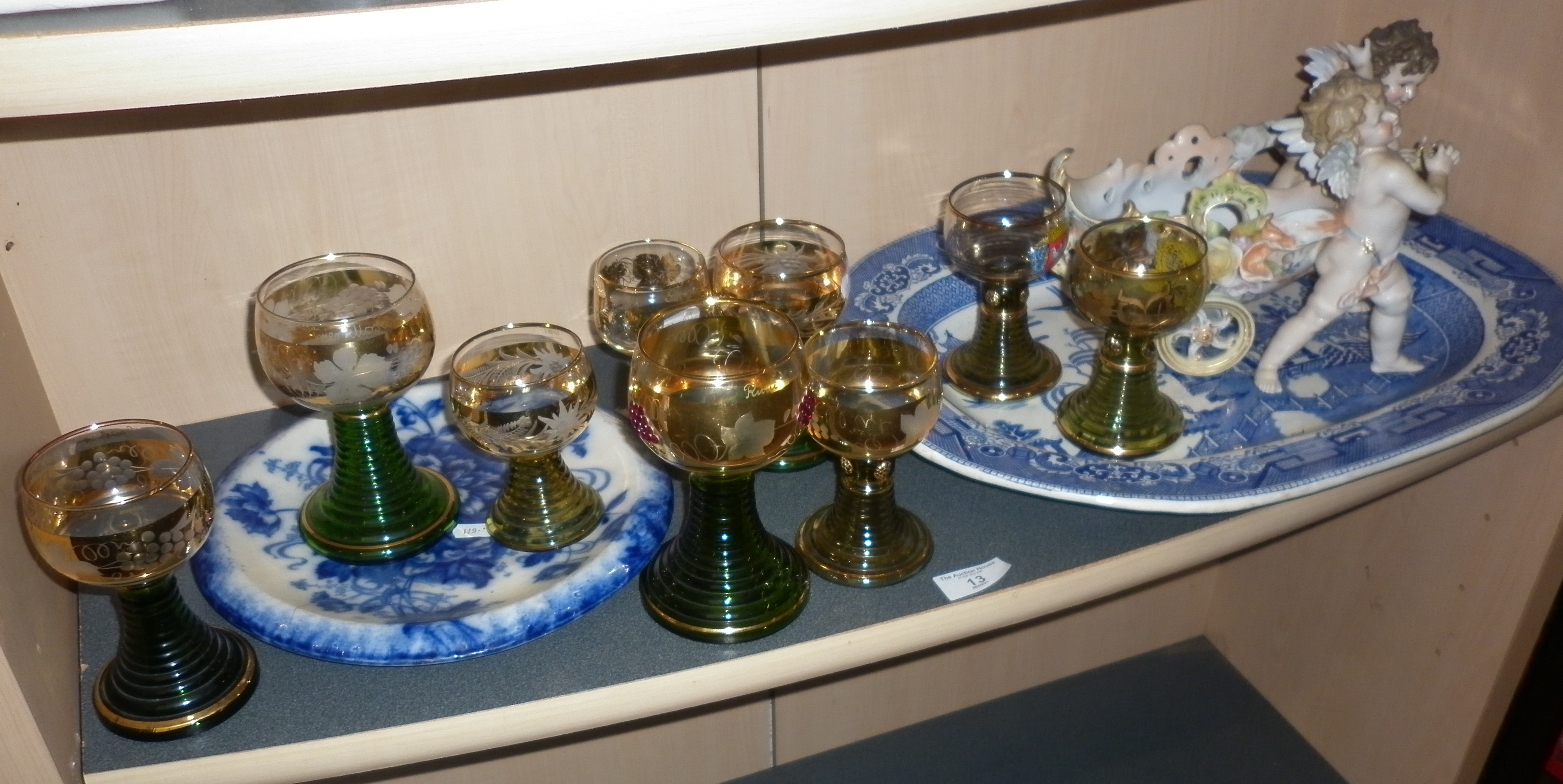 Nine assorted German hock glasses having gold vine leaf decoration and green stepped stems, a Willow