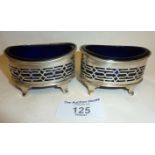 Pair of pierced silver salts with blue glass liners by the Haseler Brothers. One with Birmingham