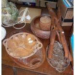 Three carved wooden fruit bowls, an oval carved tray and a carved wood intertwined folding stand