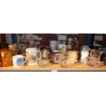 Shelf of assorted pottery and glass tankards