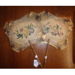 Pair of Regency painted card face screens with turned wood handles