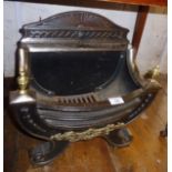 Regency style cast iron fire grate with brass mounts